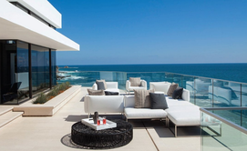 Coastal property and balcony with views of ocean